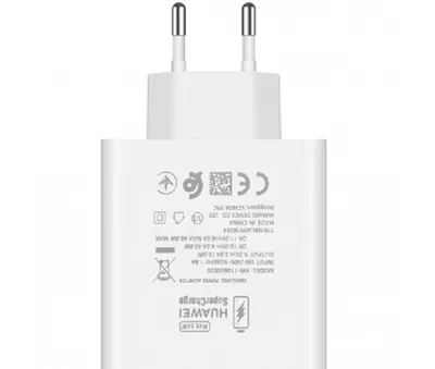 A white Huawei SuperCharge power adapter with visible text and regulatory symbols.