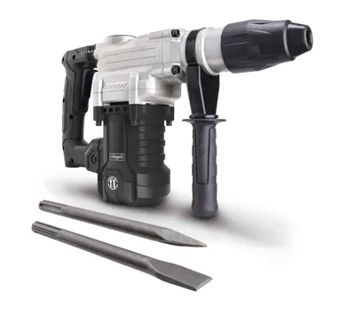 A rotary hammer drill with two chisels in front of it, set against a white background.