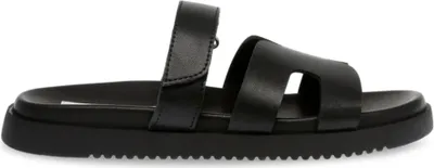 A black sandal is shown from the side against a white background.
