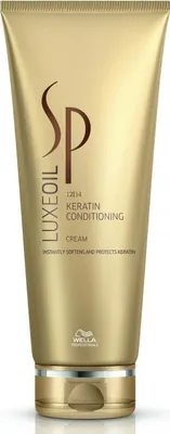 A gold colored tube of Wella Professionals SP Luxe Oil Keratin Conditioning Cream.