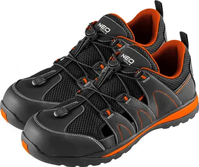 A pair of black and orange safety sandals shown from a slightly elevated front-side angle against a white background.