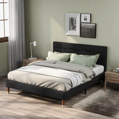 A bedroom scene with a bed in the foreground.