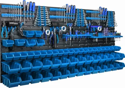 A wall-mounted tool organizer with numerous blue storage bins and various tools displayed on black panels.