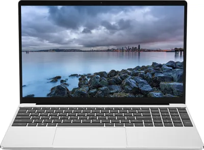 A laptop computer is displayed front and center against a white background. The laptop screen shows a scenic landscape with a city skyline in the distance.