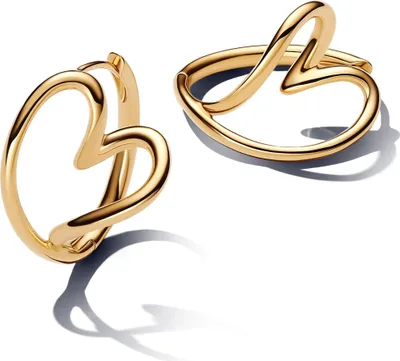Two gold heart-shaped hoop earrings are displayed on a white background.