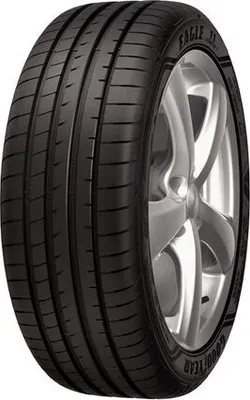 A close-up studio shot of a Goodyear Eagle F1 tire mounted on a silver alloy wheel, against a white background.