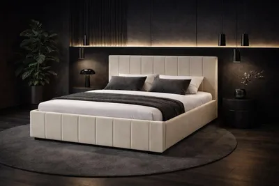 A modern bedroom with a beige upholstered bed.