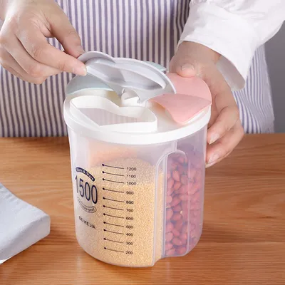 A person's hands are shown opening the lid of a multi-compartment food storage container filled with grains and nuts.