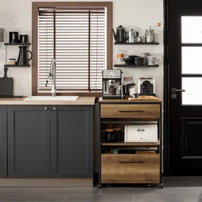 A kitchen scene featuring a rolling cart with various kitchen appliances and storage.