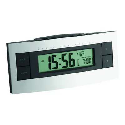 A digital alarm clock with a silver frame and a black face displaying the time and alarm settings.