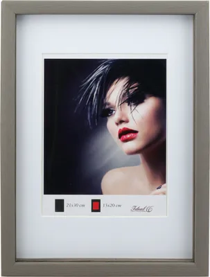 A framed picture of a woman with dramatic makeup and hairstyle.