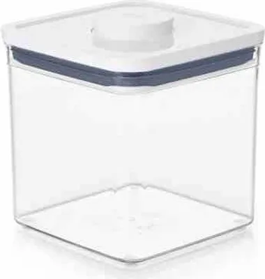 A clear, studio shot of a square, clear plastic food storage container with a white lid and a blue seal.