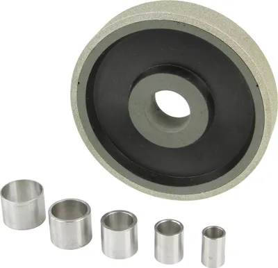A diamond grinding wheel and several metal bushings are displayed against a white background.