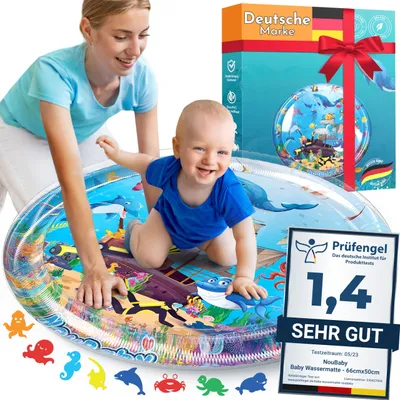 A mother and baby are playing on an inflatable water mat.