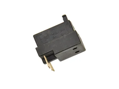 A black electrical switch with gold metal connectors against a white background.