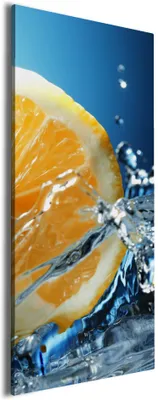 Produktbild von Wallario Premium Leinwandbild Orange in spritzigem Wasser vor blauem Hintergrund in Größe 80 x 200 cm