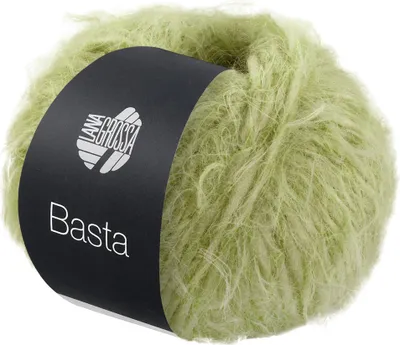 A ball of light green, fuzzy yarn with a black label wrapped around it.