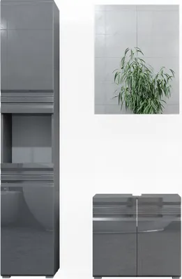 A collage of bathroom furniture pieces and a plant against a tiled wall.