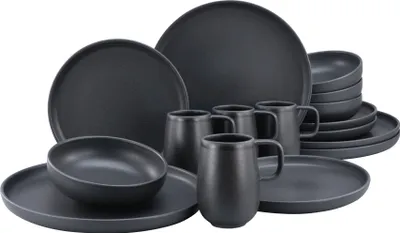A set of dark gray stoneware dishes and mugs are arranged on a white background.