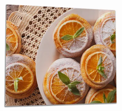 Produktbild von Wallario Herdabdeckplatte aus Glas, Größe 60 x 52 cm 1-teilig, Motiv Frische Biskuits mit Orangenscheiben