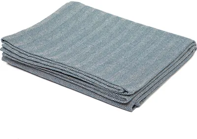 A folded blue and gray herringbone patterned blanket.
