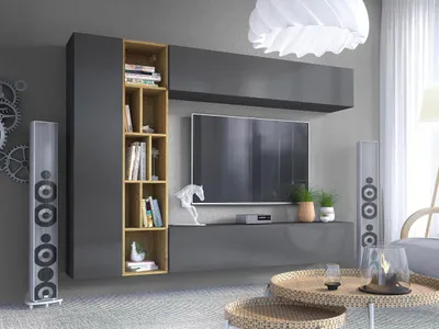 A modern living room setup featuring a wall-mounted entertainment unit with a TV, shelving, and speakers.
