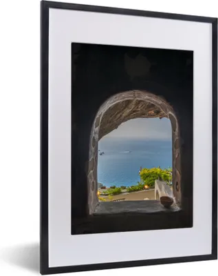 Produktbild von MuchoWow® MuchoWow® Gerahmtes Poster Blick auf das Meer durch ein Steinfenster 30x40 cm - Poster mit zchwarzem Bilderrahmen - Wandposter Schlafzimmer