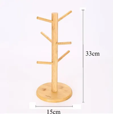 A wooden mug tree stand with dimensions indicated.