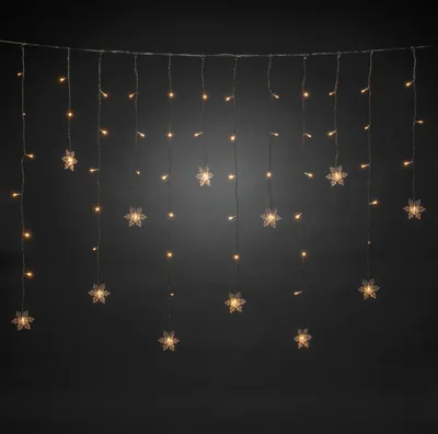 Produktbild von Konstsmide - LED Lichtervorhang, 12 klare Schneeflocken, 60 warm weiße Dioden, 4,5V, Außen (IP44), transparentes Kabel- 4049-103