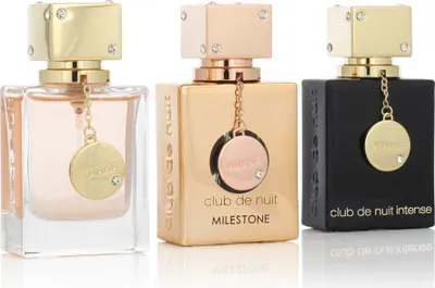 Three perfume bottles are displayed side-by-side against a white background.