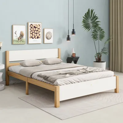A bedroom scene featuring a bed, artwork, and a plant.