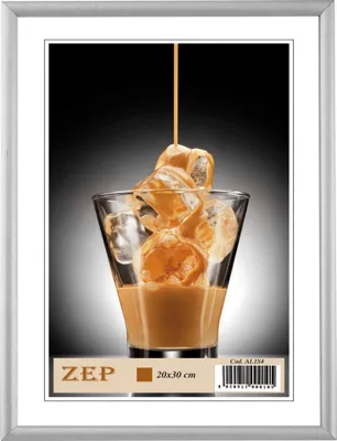 A framed poster of a drink being poured over ice cubes.