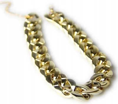 A close-up shot of a gold-colored chain necklace on a white background.