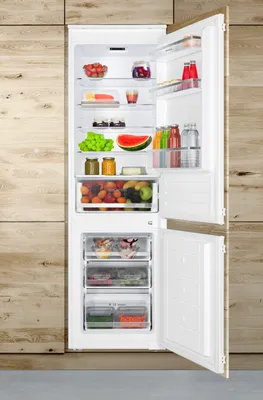 An open refrigerator filled with various food items.