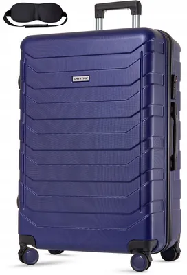 A dark blue suitcase with a black eye mask placed above it.