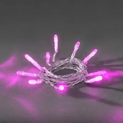 A coiled string of pink LED lights on a gray background.