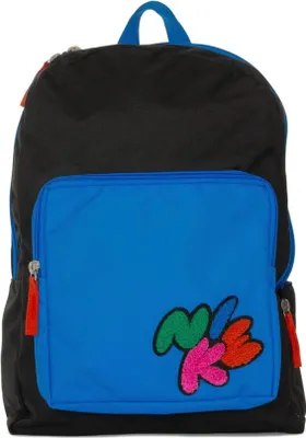A black and blue Nike backpack with colorful lettering on the front pocket.