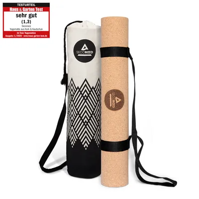 A rolled-up cork yoga mat and its carrying bag are displayed against a white background.