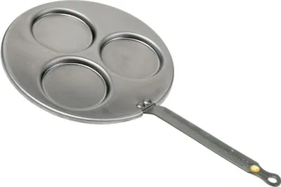 A close-up, angled view of a multi-sectioned frying pan against a white background.