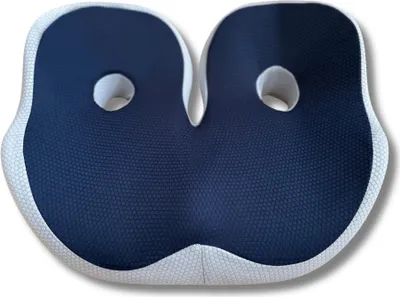 A dark blue and white ergonomic seat cushion with two circular cutouts.