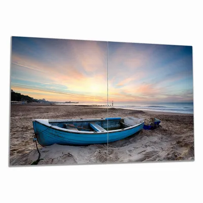 Produktbild von Wallario Herdabdeckplatte aus Glas, Größe 80 x 52 cm 2-teilig, Motiv Fischerboot am Strand bei Sonnenuntergang