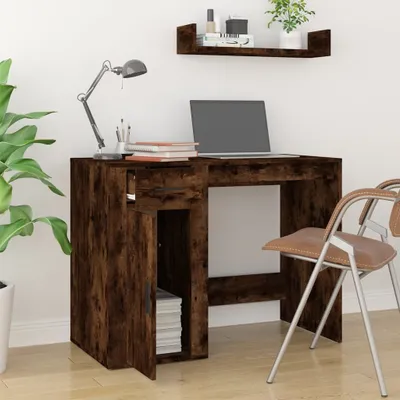 A desk with a laptop, lamp, and chair in a room.