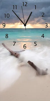 Produktbild von Wallario Design Wanduhr bedruckt, Größe 30 x 60 cm, Motiv: Wellen am Strand bei Sonnenuntergang