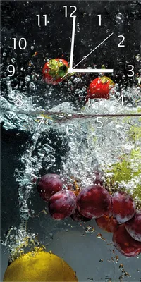 Produktbild von Wallario Design Wanduhr bedruckt, Größe 30 x 60 cm, Motiv: Früchte im und unter Wasser - Splashing Fruits