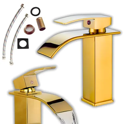 A collection of gold-colored bathroom faucets and plumbing accessories against a white background.