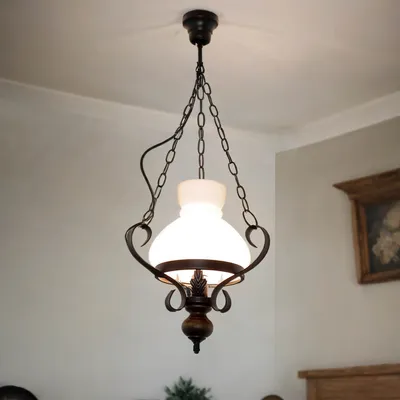 A hanging lamp is shown against a white ceiling and wall.