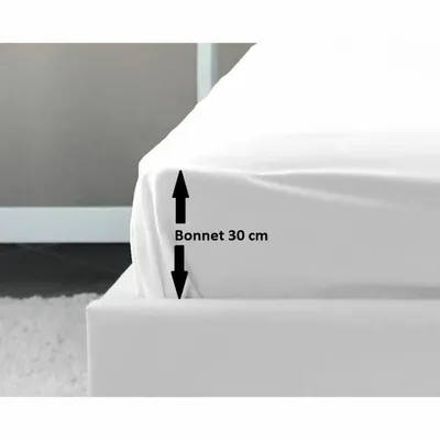 A close-up of a white fitted sheet on a bed, showing the depth of the sheet.