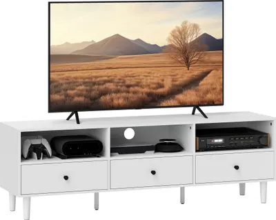 A white TV stand with a television on top, and electronic devices on the stand.