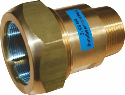 A close-up studio shot of a brass plumbing fitting against a white background.