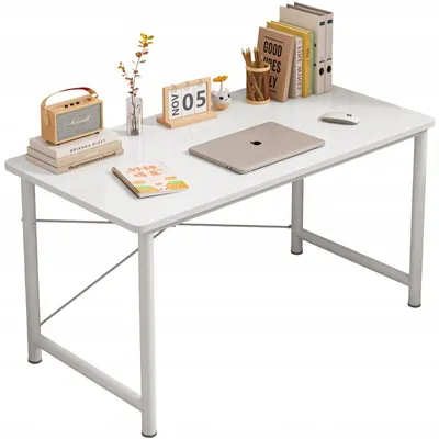 A white computer desk with various office supplies and decorative items.